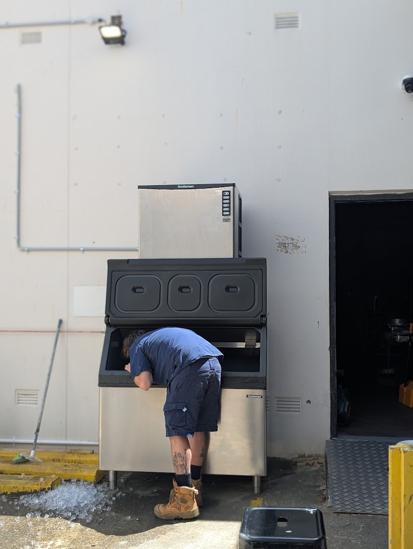 CHEFTECH technician servicing a Scotsman commercial ice machine bin on site